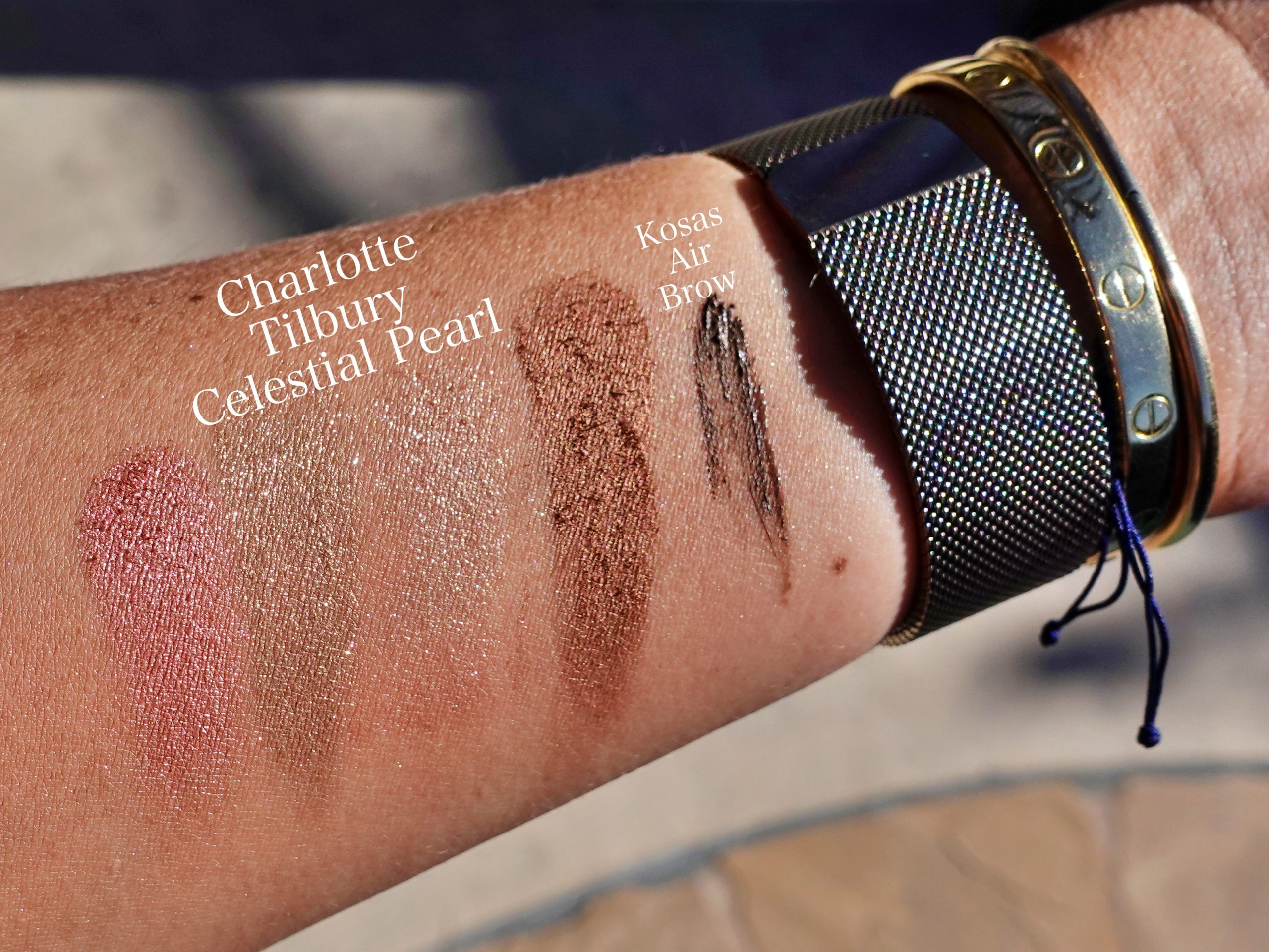 Swatches of the Charlotte Tilbury Celestial Pearl Palette in direct sunlight for here comes the sun