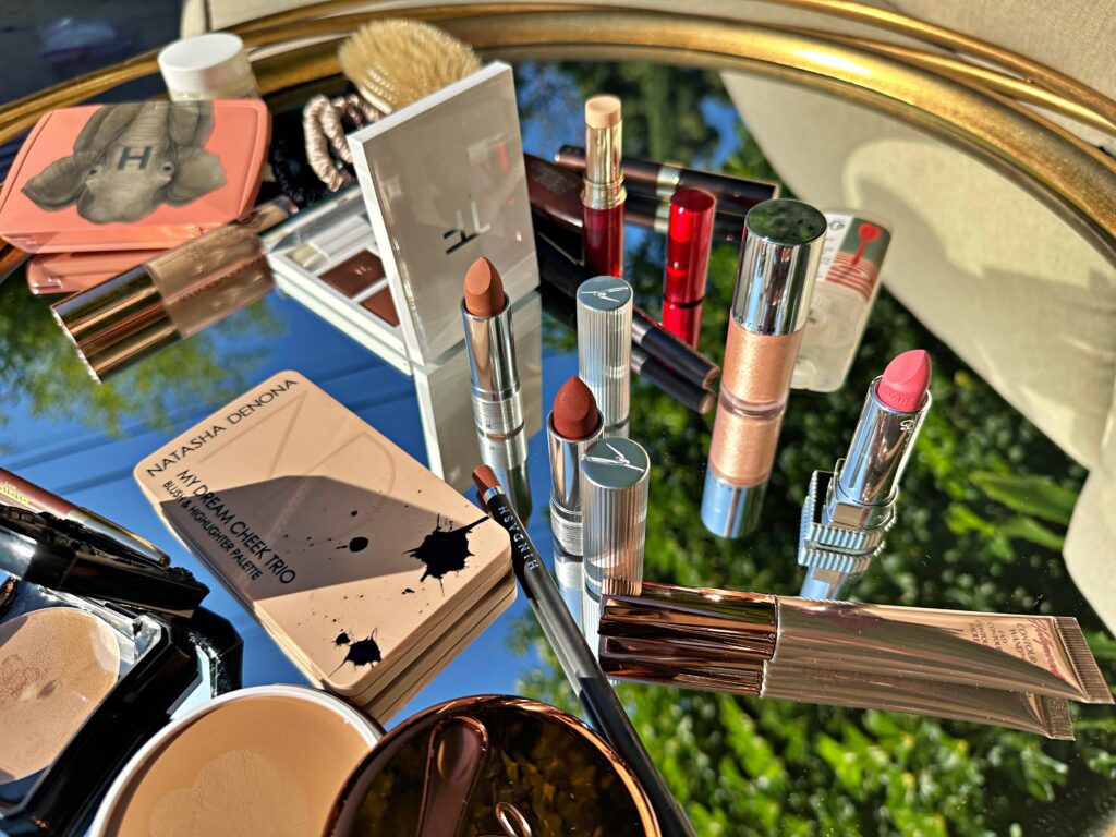 different beauty products on top of a mirror