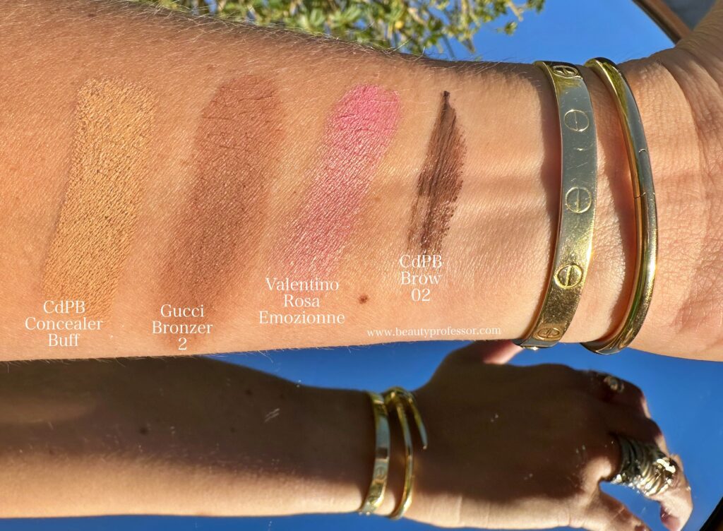 lipstick swatches on arm and woman sharing her Favorite Fragrances