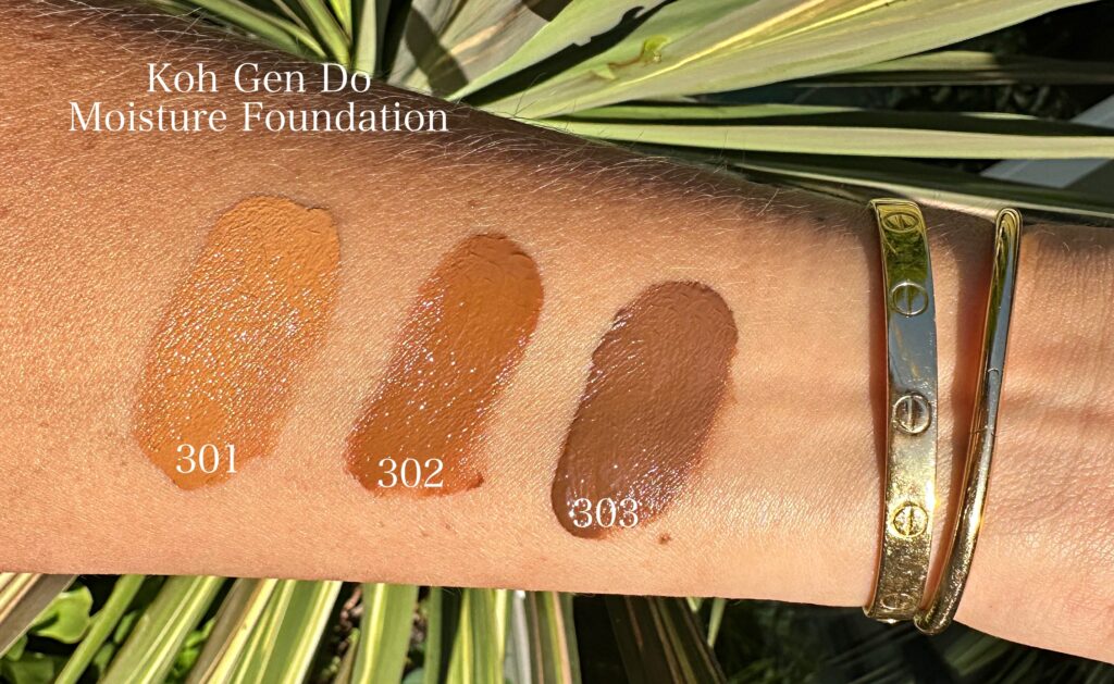 Three swatches of the Koh Gen Do Moisture Foundation in direct sunlight