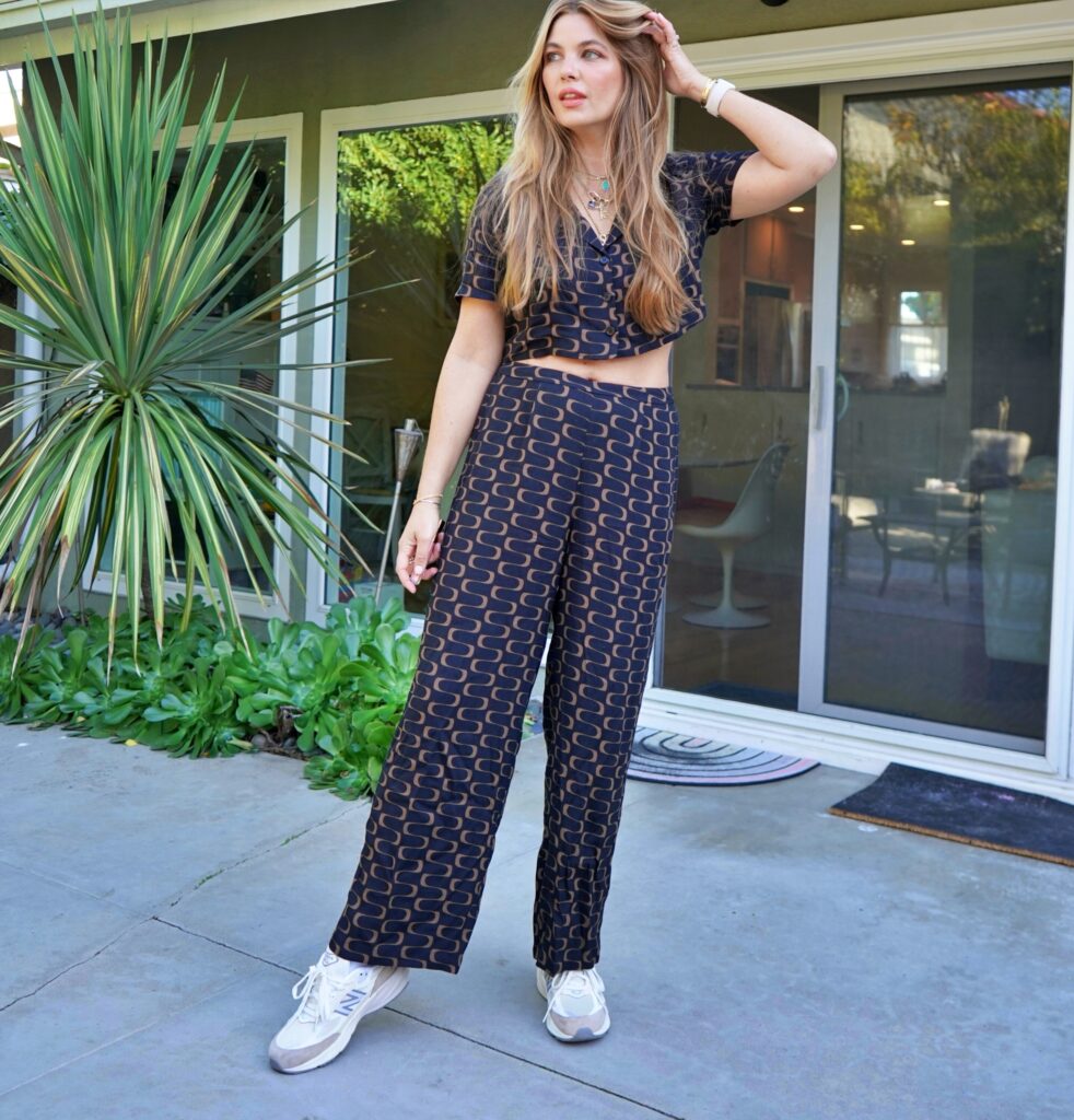 Rachel Anise Wegter  wearing chic two-piece set and New Balance sneakers