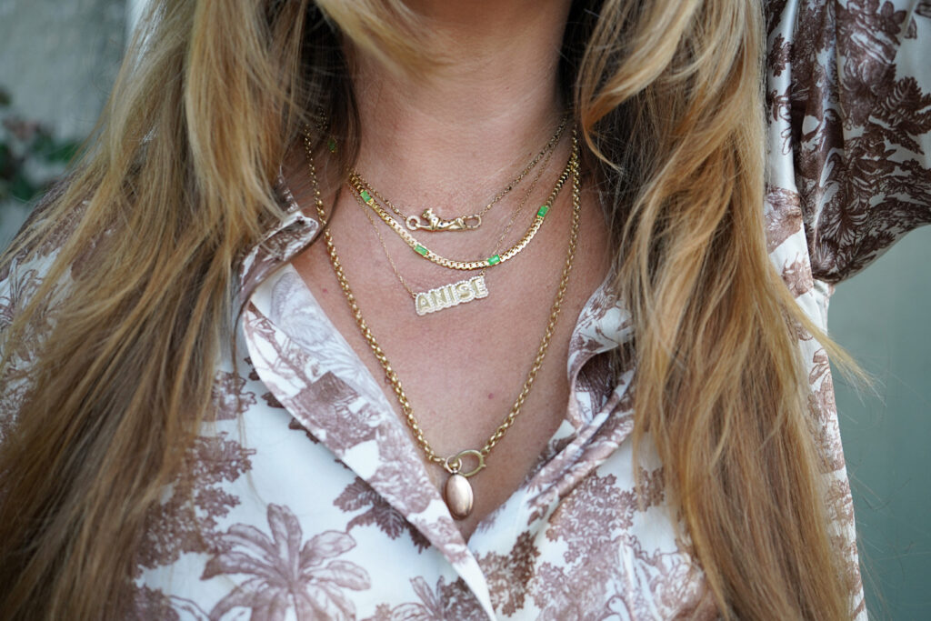 Beauty Professor Blogger Rachel Anise Wegter sharing wearing her Nordstrom Anniversary Sale picks: a gold necklace with semi-precious green stones